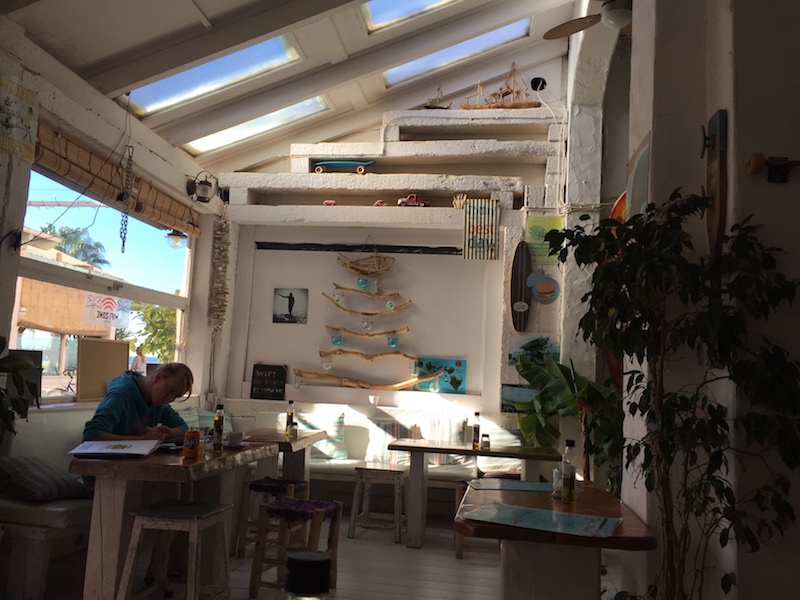 Image showing the office of a digital nomad. It displays Stocked, a cafe in Tarifa, Spain that is nicely decorated.