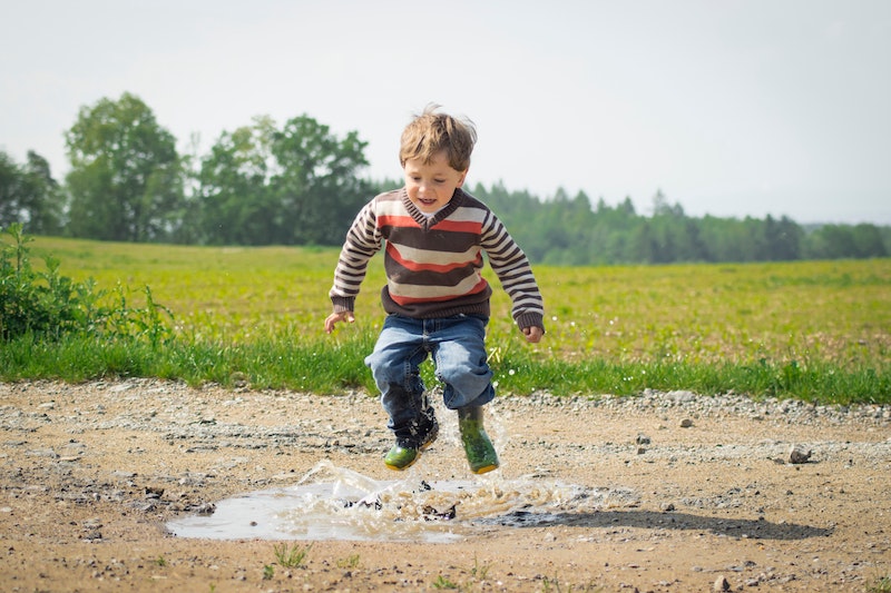 Children jumping in a puddle, enjoing the moment and having fun, like people listening to their inner voice.